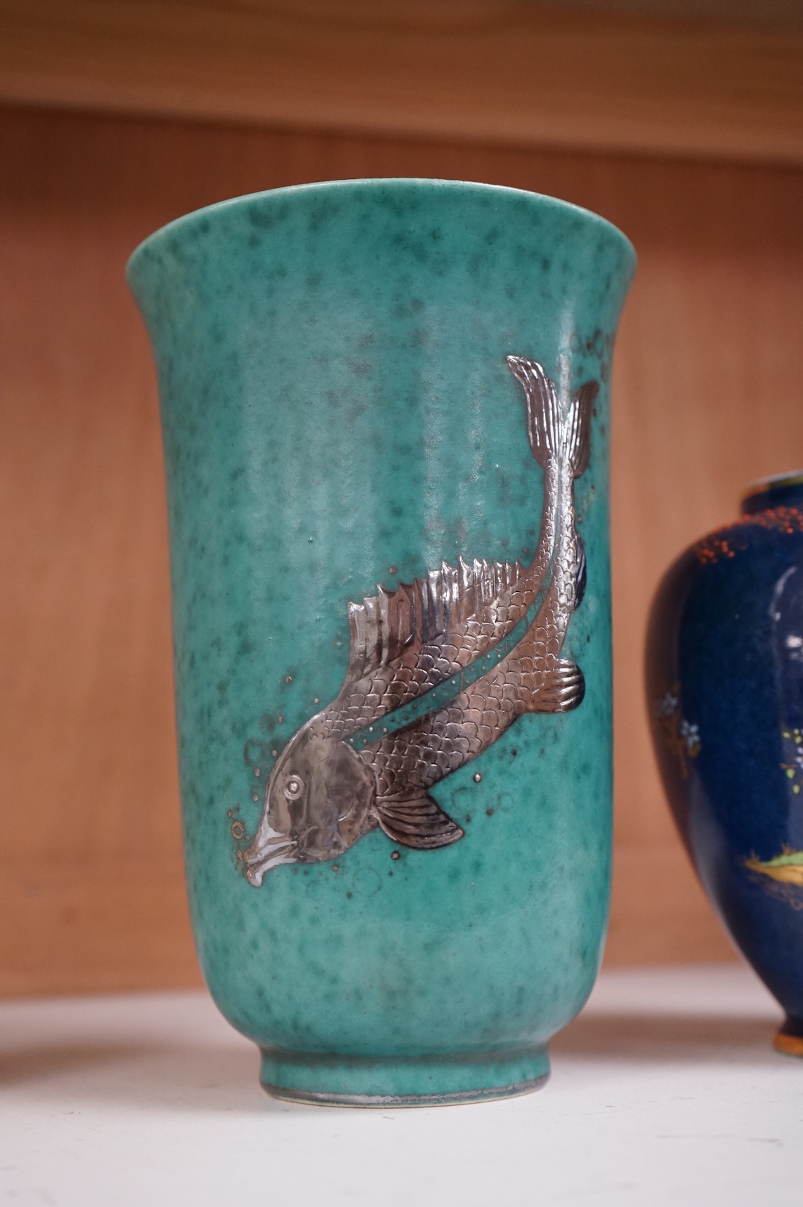 A Gustavsberg Argenta ware vase and a Carlton ware vase, tallest 16.5cm high.